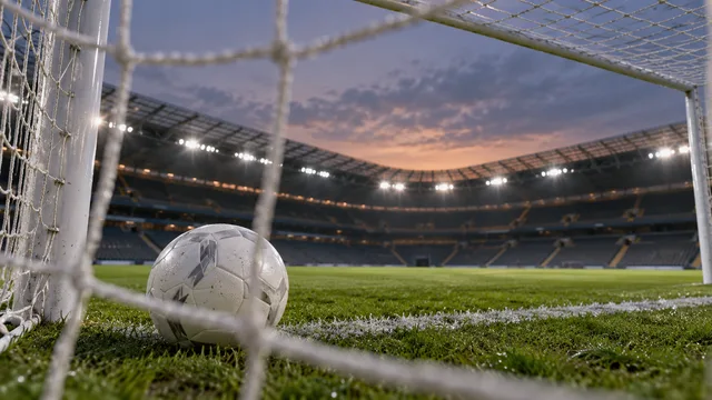 AI-generated illustration of an unbranded football beside the goal line and net in an empty floodlit stadium at twilight.